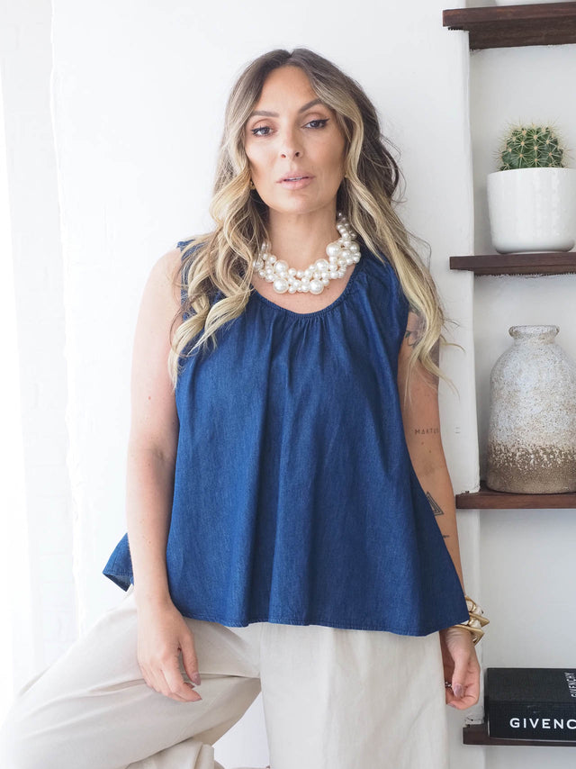 Top de ganga feminino com corte largo, gola redonda e manga cava, ideal para looks casuais de verão.