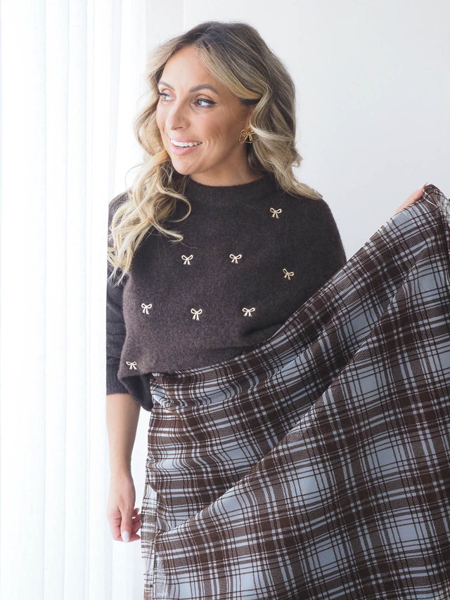 Pull tricoté avec nœuds