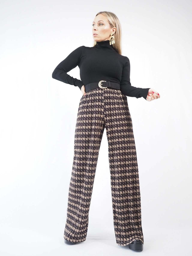 Calças pantalonas estampadas flúidas cinta alta.